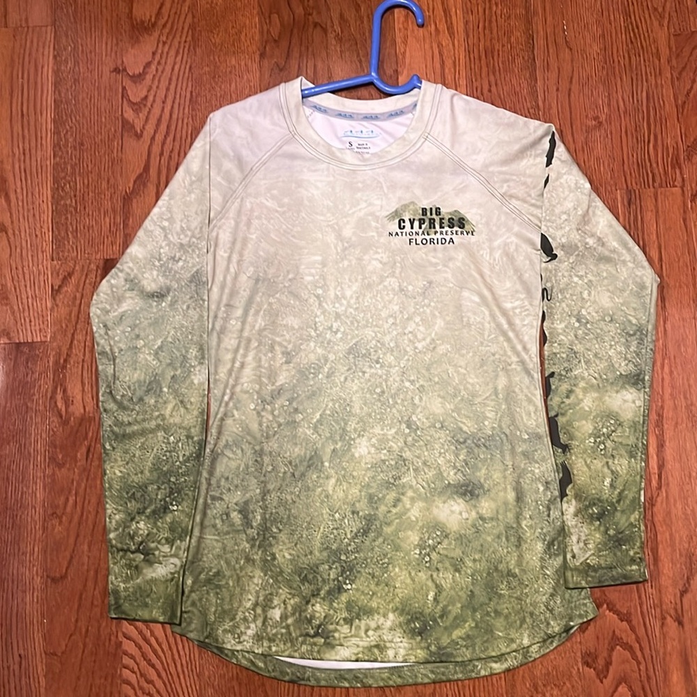 A women’s, like new, UPF shirt